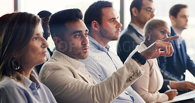 Buy stock photo Man, audience and point with discussion at conference with business people, insight or feedback. Person, crowd and gesture for review, workshop or attention with team at corporate training convention