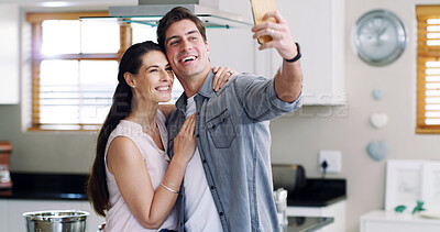 Buy stock photo Photography, love and couple with selfie in kitchen, social media post or capture moment for memory. Connection, bonding or happy people with embrace for profile picture, support or affection in home