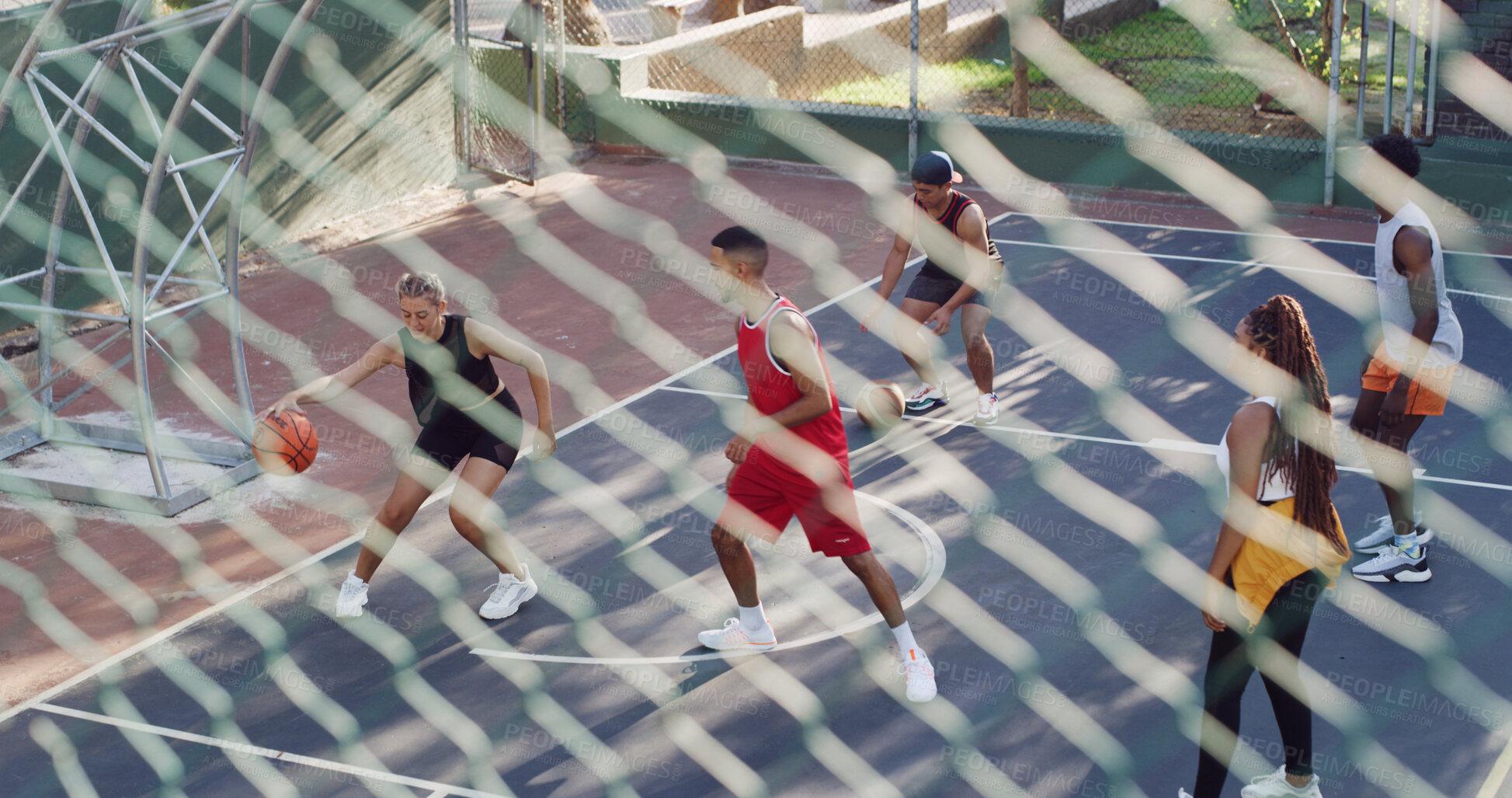 Buy stock photo Basketball court, team and fitness with friends, fence and practice for competition, above and game. Outdoor, athlete and training for match, people and cardio for sport tournament or challenge