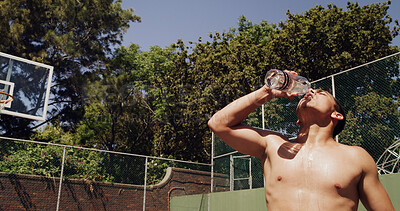 Buy stock photo Man, drink and water on basketball court for outdoor sport, competition or fitness game. Athlete, thirst and sweat with liquid for health, hydration and training in summer for exercise or workout