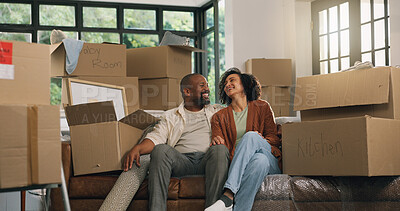 Buy stock photo Moving, couple and relax in new home, laughing and relocation for property investment. African man, woman and dream house with mature people, real estate and funny homeowners on sofa in living room