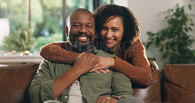 Buy stock photo Portrait, mature couple and hug in home with smile, love and connection for bonding together on weekend. Happy, black people and embrace in living room with marriage commitment, trust and support.
