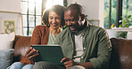 Tablet, laugh and black couple in living room for bonding, streaming and happy in home. African man, woman and technology with comedy movie, film or funny video with meme or joke on social media