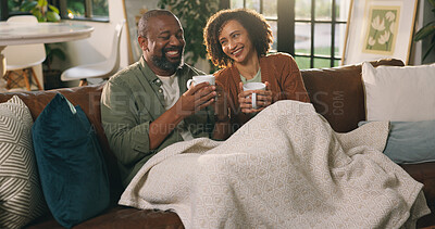 Buy stock photo Relax, coffee or couple with smile on couch, funny conversation or partner joke for weekend bonding. Love, laugh and mature African people with tea to chill, comfortable and chat together in home
