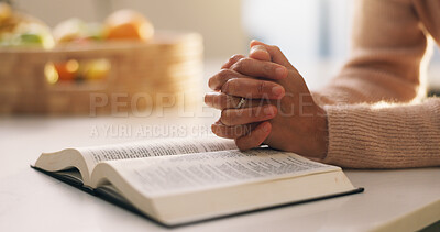 Buy stock photo Bible, praying and hands of woman in home with comfort, support or religion for spirituality. Worship, trust and person with prayer by holy book for reading gospel with gratitude or peace in house.