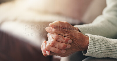 Buy stock photo Faith, hands and prayer with senior person on sofa in living room of home for belief in God. Holy, praying and religion with elderly Christian in apartment for healing, spirituality or trust in Jesus