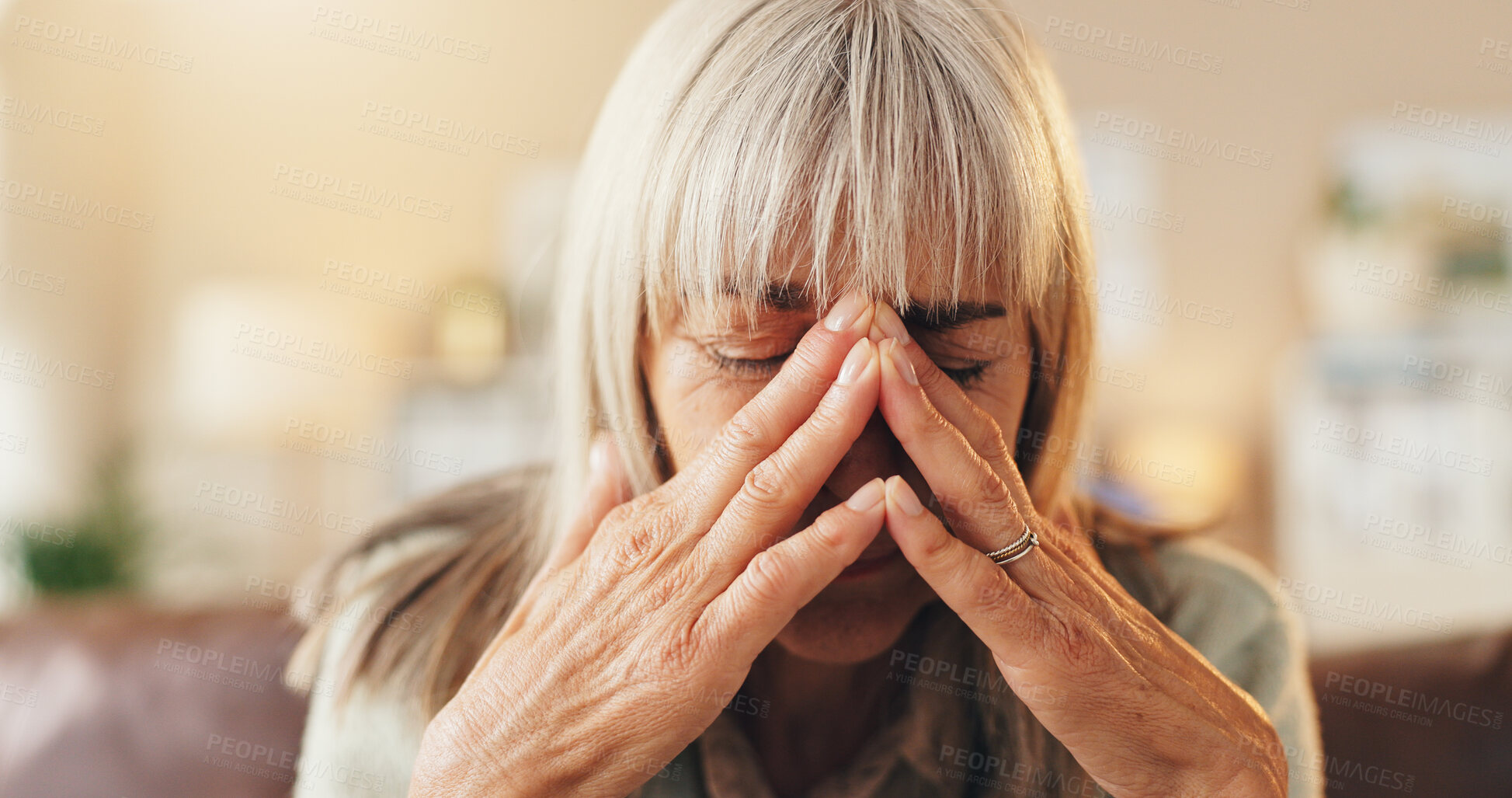 Buy stock photo Anxiety, headache or psychology with senior woman on sofa in living room of home for mental health. Burnout, grief or pain and elderly person with depression in apartment for reaction to trauma