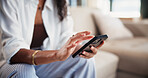 Hands, woman and typing with phone in home for social media, browsing website and text message. Female person, reading and mobile for networking, celebrity gossip and texting with notification update
