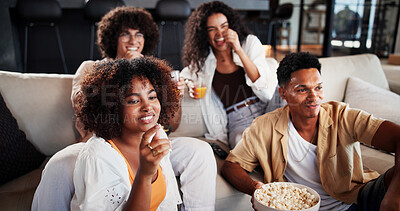 Buy stock photo Couple of friends, happy and relax with watching tv on sofa for movie, comedy show or snack in living room. People, smile and drinks on couch for film, subscription and television in lounge at home