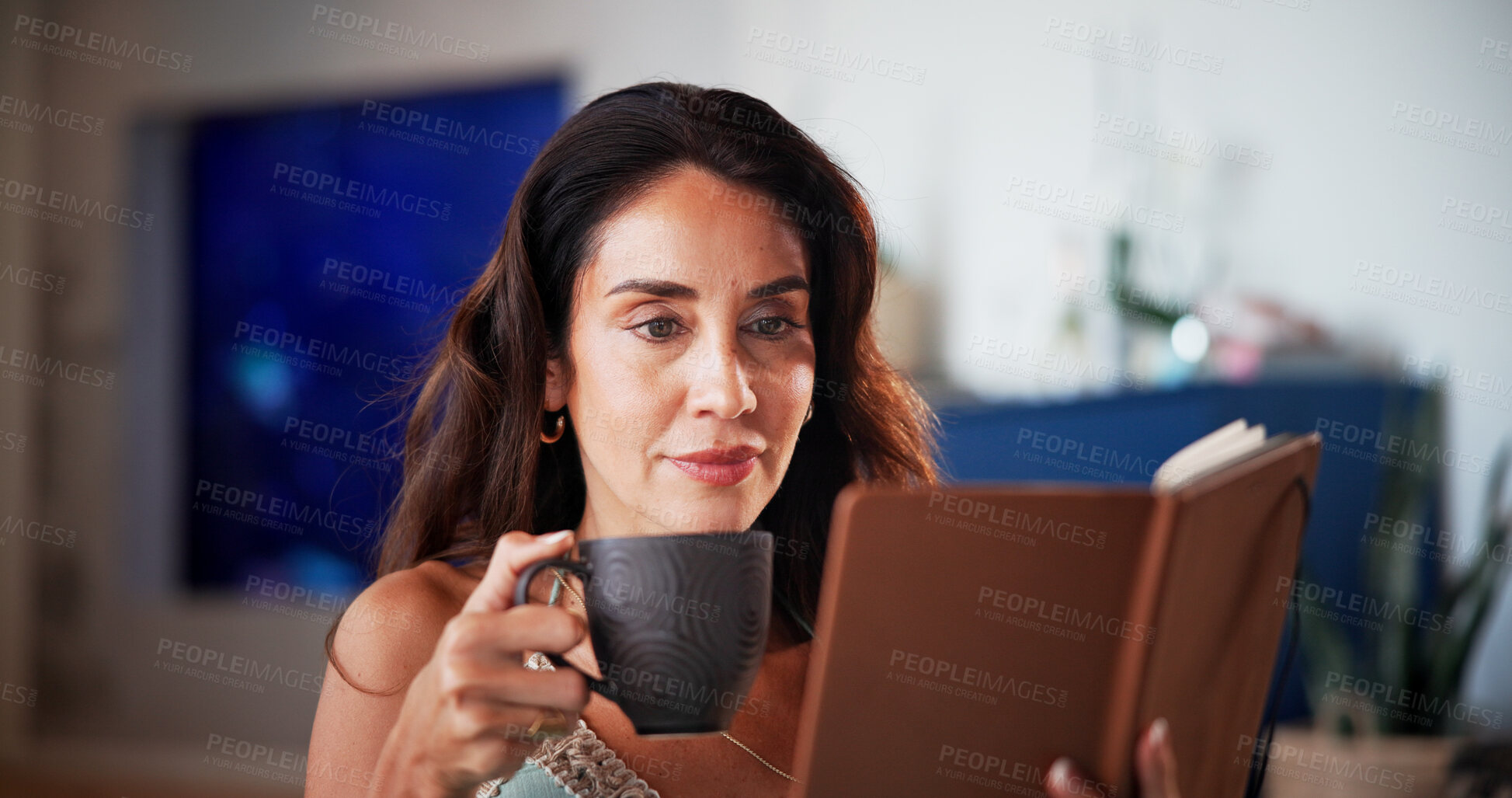 Buy stock photo Coffee, reading and woman with book in home for hobby, relax and literature for knowledge. Happy, mature and person with drink and novel, story or fantasy for peace, calm and learning in living room