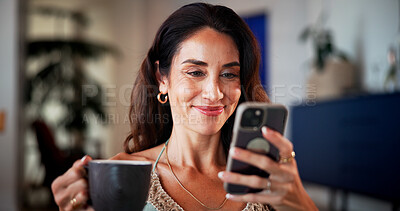 Buy stock photo Coffee, smile and woman with phone on sofa in home with networking, contact or social media on mobile app. Happy, cellphone or mature person with warm beverage for communication online in living room