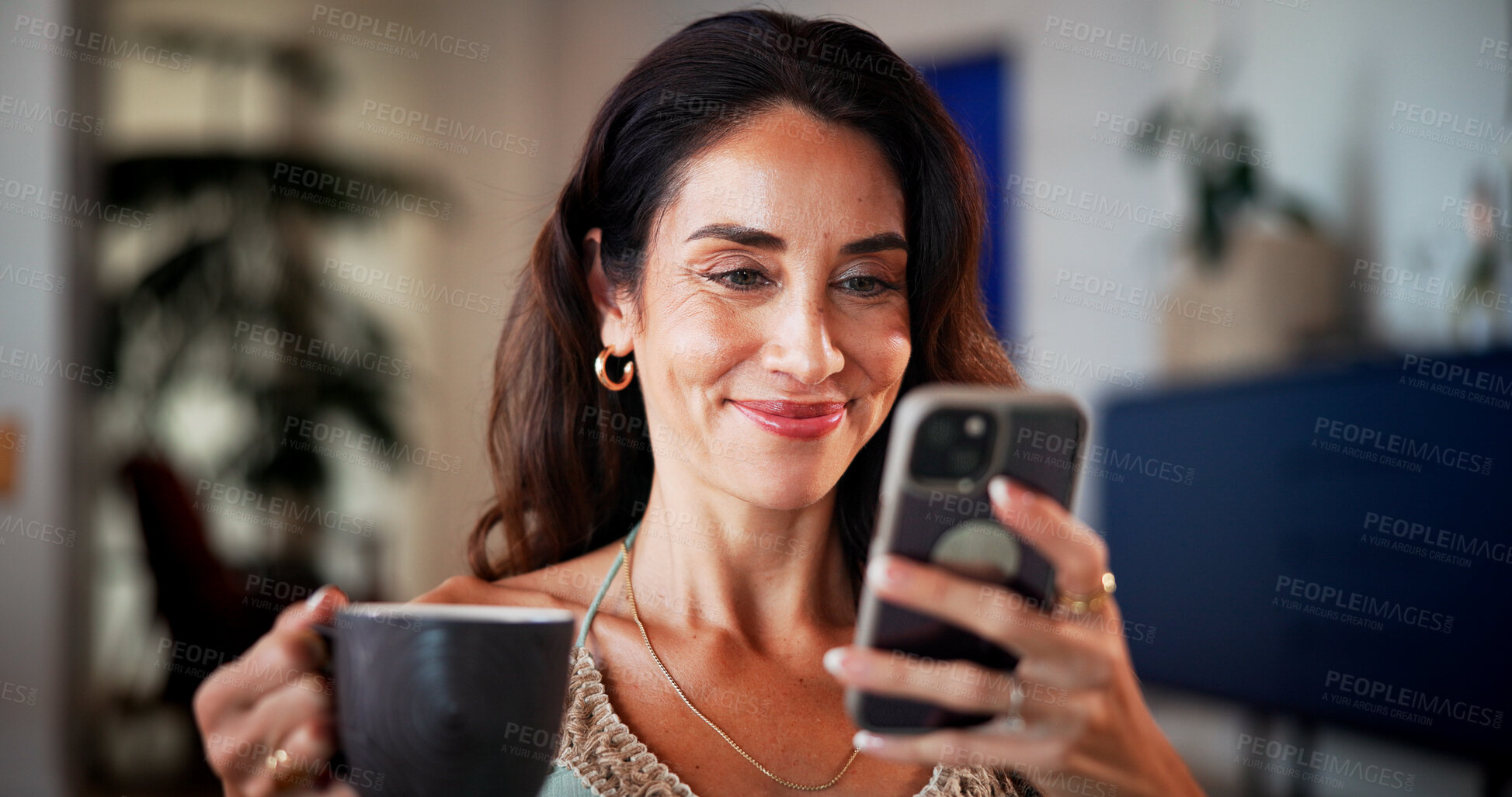 Buy stock photo Coffee, smile and woman with phone on sofa in home with networking, contact or social media on mobile app. Happy, cellphone or mature person with warm beverage for communication online in living room