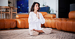 Meditation, prayer hands and woman in home for health, self care or wellness in living room. Yoga, calm and female person with balance for peace, zen or grounding exercise in morning at apartment.