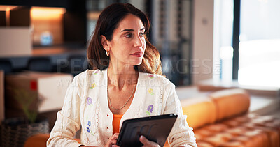 Buy stock photo Remote work, thinking or woman in lounge with tablet, draft insight or planning for article. WFH, reflection or mature journalist in house with tech, story idea or industry research for publication.
