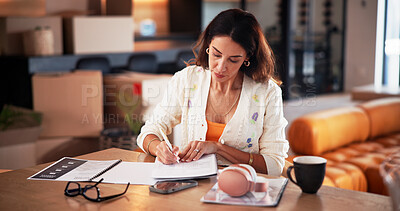 Buy stock photo Paperwork, freelancer and writing with proposal in home for publication, article and remote work. Reporter, journalist and female person with project, document and planning for story editor in house