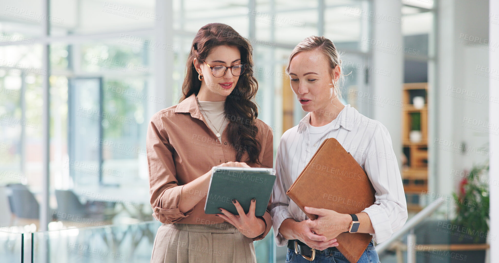 Buy stock photo Women, team and tablet with discussion at startup with review, insight and planning at media company. People, writer and editor with tech, application or feedback report with talk at creative agency