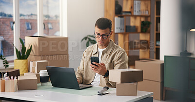 Buy stock photo Ecommerce, laptop and phone with man in logistics office together for delivery of online order. App, computer and distribution with supply chain employee in workplace for shipping or tracking