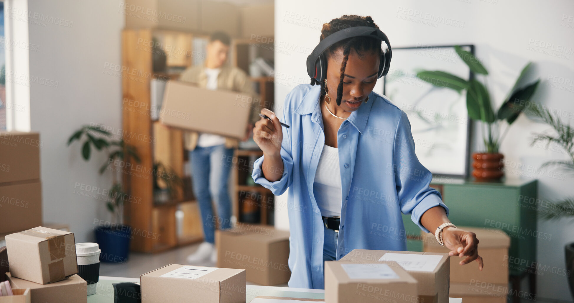 Buy stock photo Boxes, headphones and woman in office, startup for ecommerce and app for radio. Person, cardboard and entrepreneur in workplace, sound and listening to music, audio and checking for product barcode