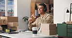Boxes, headphones and happy man in office, startup for ecommerce and app for radio. Person, cardboard or entrepreneur in workplace, dancing and listening to music, sound or excited for album playlist