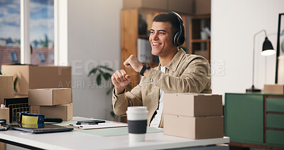 Buy stock photo Boxes, headphones and happy man in office, startup for ecommerce and app for radio. Person, cardboard or entrepreneur in workplace, dancing and listening to music, sound or excited for album playlist