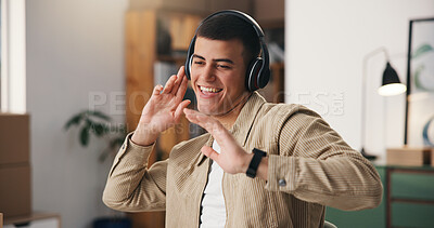 Buy stock photo Dancing, headphones and man in home with music, radio or playlist for good mood in living room. Happy, singing and male person with audio tech for streaming album or song for groove in apartment.