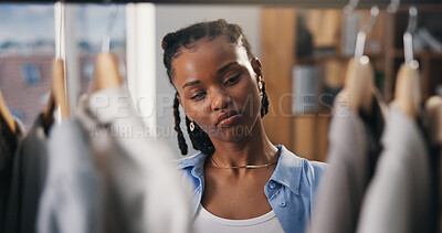 Buy stock photo Choice, fashion and black woman in boutique for shopping, stylish clothes and luxury retail. African person, consumer and customer in store, thinking or options for fabric, promotion or discount