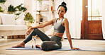 Exercise, portrait and yoga with woman in living room of home for break, holistic wellness or hydration. Bottle, smile and water with happy yogi person on floor in apartment for health activity
