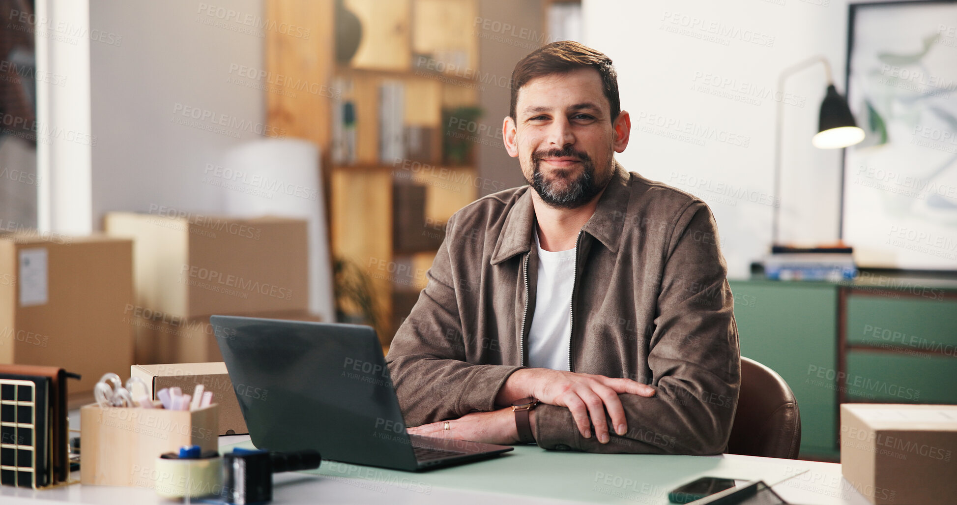 Buy stock photo Portrait, smile and man in office for shipping, procurement startup and laptop in small business. Computer, ecommerce and happy person at work for distribution, logistics and confident entrepreneur