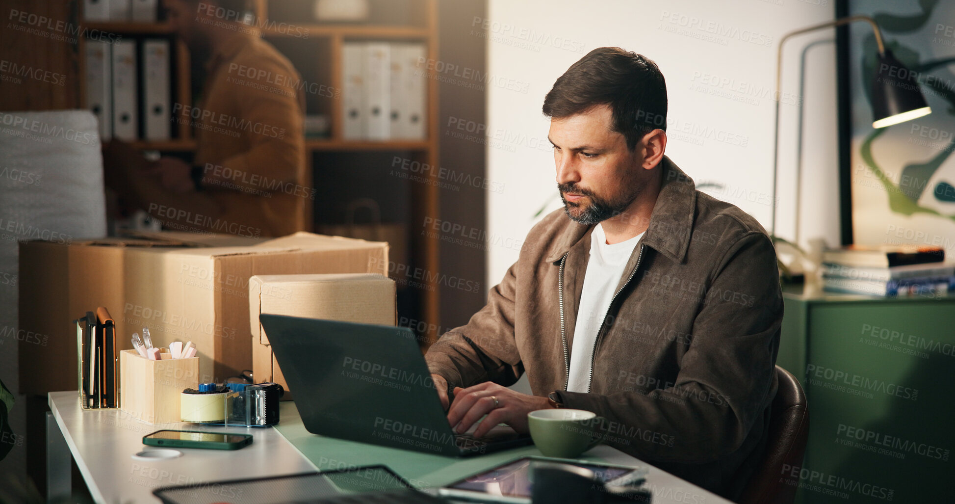Buy stock photo Laptop, logistics and businessman in office with email for online delivery information. Computer, typing and male supply chain manager with ecommerce for shipping communication by boxes in workplace.