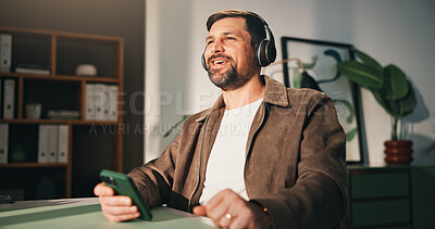 Buy stock photo Headphones, phone or happy man with break in home office, music listening or podcast for remote work. Mobile, feel good playlist or freelancer with tech for streaming, radio or album for productivity