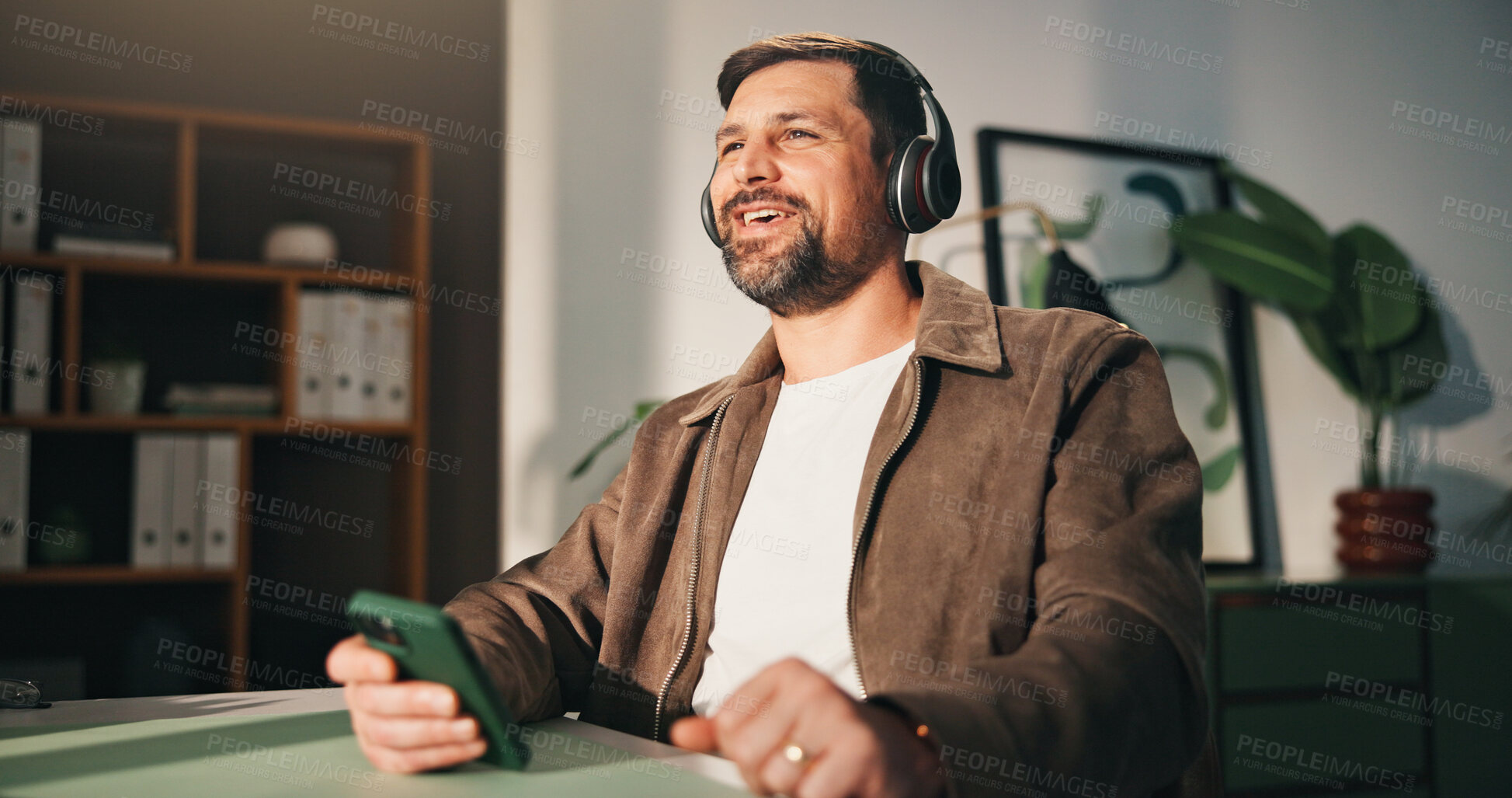 Buy stock photo Headphones, phone or happy man with break in home office, music listening or podcast for remote work. Mobile, feel good playlist or freelancer with tech for streaming, radio or album for productivity