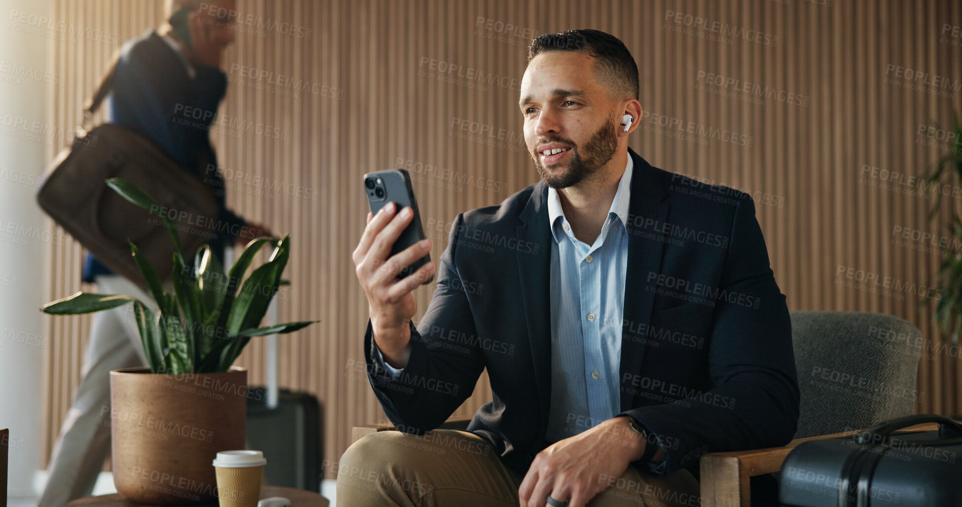 Buy stock photo Video call, phone and travel with business man in airport lounge for chat, layover update and contact. Communication, luggage and streaming with person and mobile in vip lobby for connection