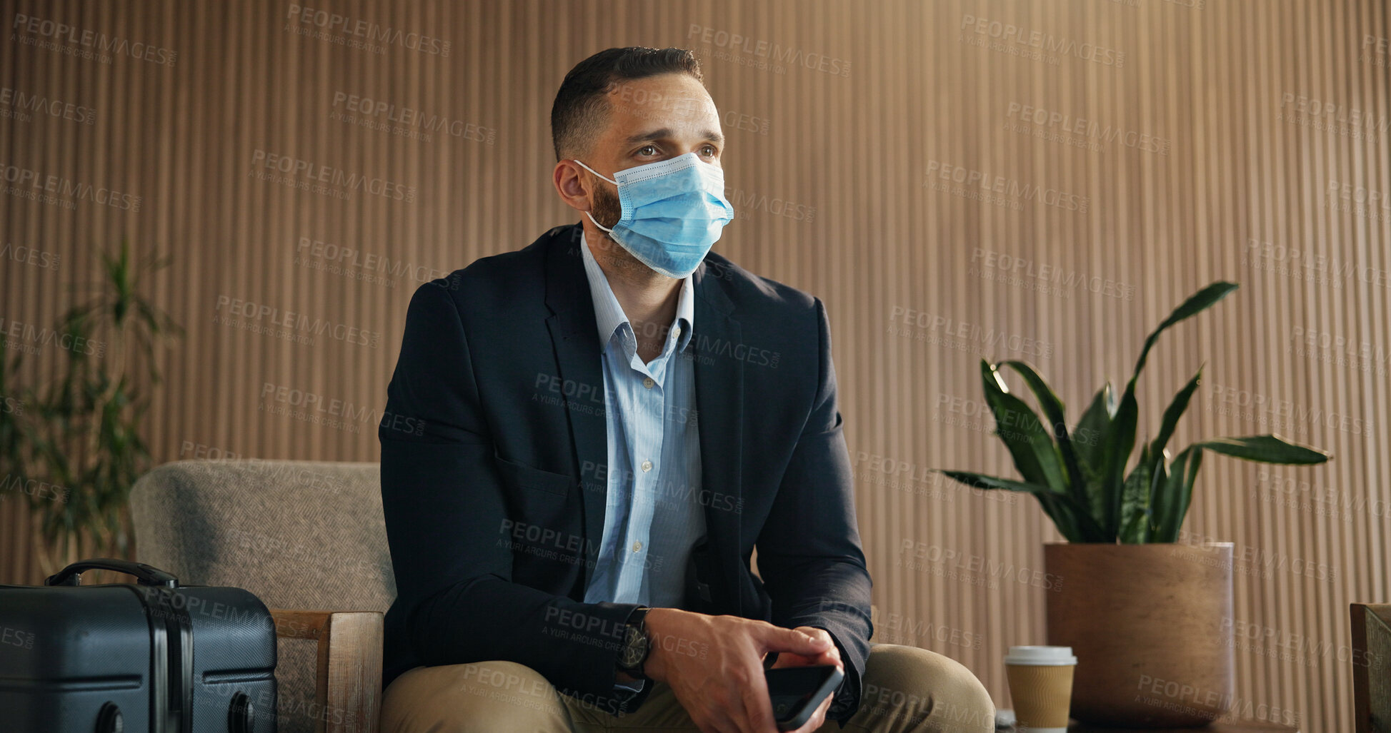 Buy stock photo Waiting room, face mask and business man in airport lounge for virus prevention, boarding compliance and safety. Outbreak regulation policy, luggage and travel with person in vip lobby for healthcare