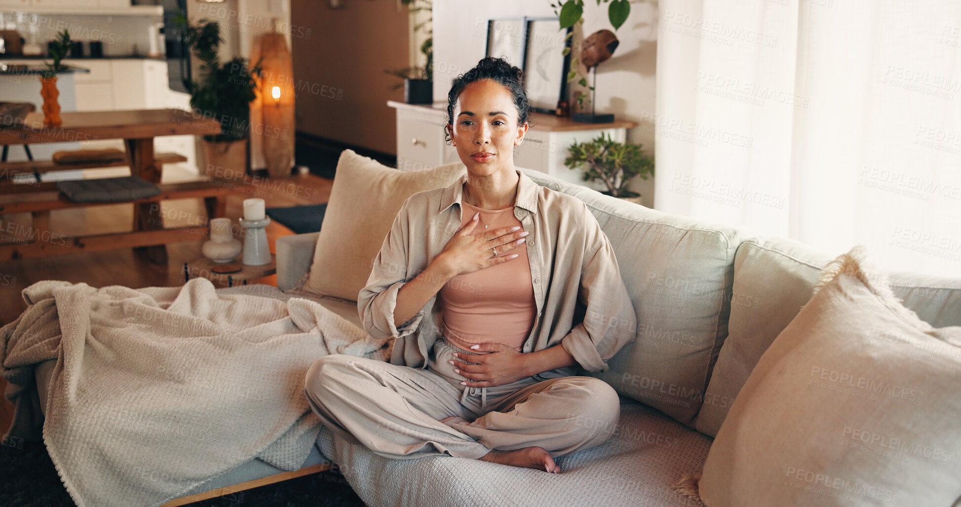 Buy stock photo Happy woman, relax and sofa with breathing exercise for practice meditation or mindfulness in home. Calm, female person or rest with inner peace for zen, mental health or spiritual wellness in house