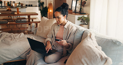Buy stock photo Laptop, payment and woman on sofa with credit card, online utility bills or fintech for eft transaction. Person, typing and computer in home with digital banking, household expenses or insurance fee.