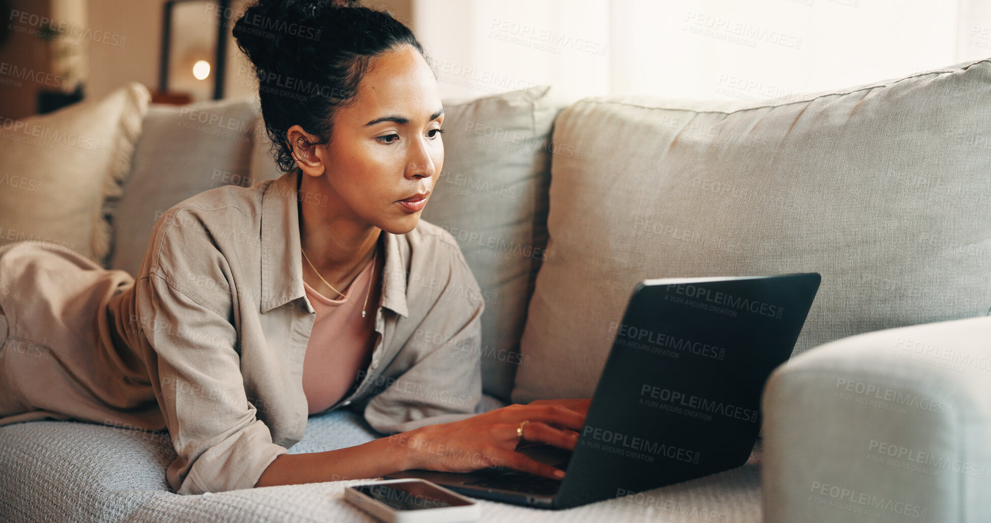 Buy stock photo Remote work, review or woman on sofa with laptop, draft edit or source feedback for article. WFH, online submission or journalist in home with tech, fact check or industry research for publication.