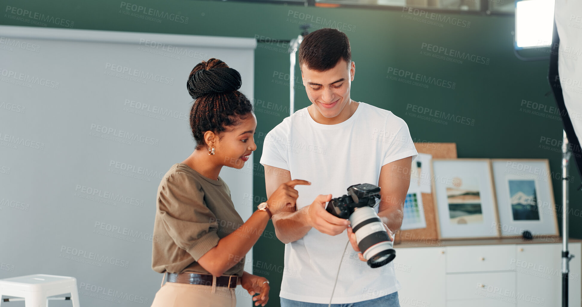 Buy stock photo Talking, photographer and model with camera for photoshoot, review image or smile for project outcome. Photography, creative studio or people with chat to check picture, production idea or pointing