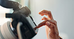 Photographer, hand and camera screen in studio with check, photoshoot and film production results. Person, fingers and review with tech for photography, media project or change settings on equipment.