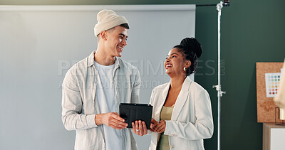 Buy stock photo Photography, tablet and teamwork with funny people in studio together for feedback or production planning. App, photoshoot or talking with photographer man and woman laughing on set for media review