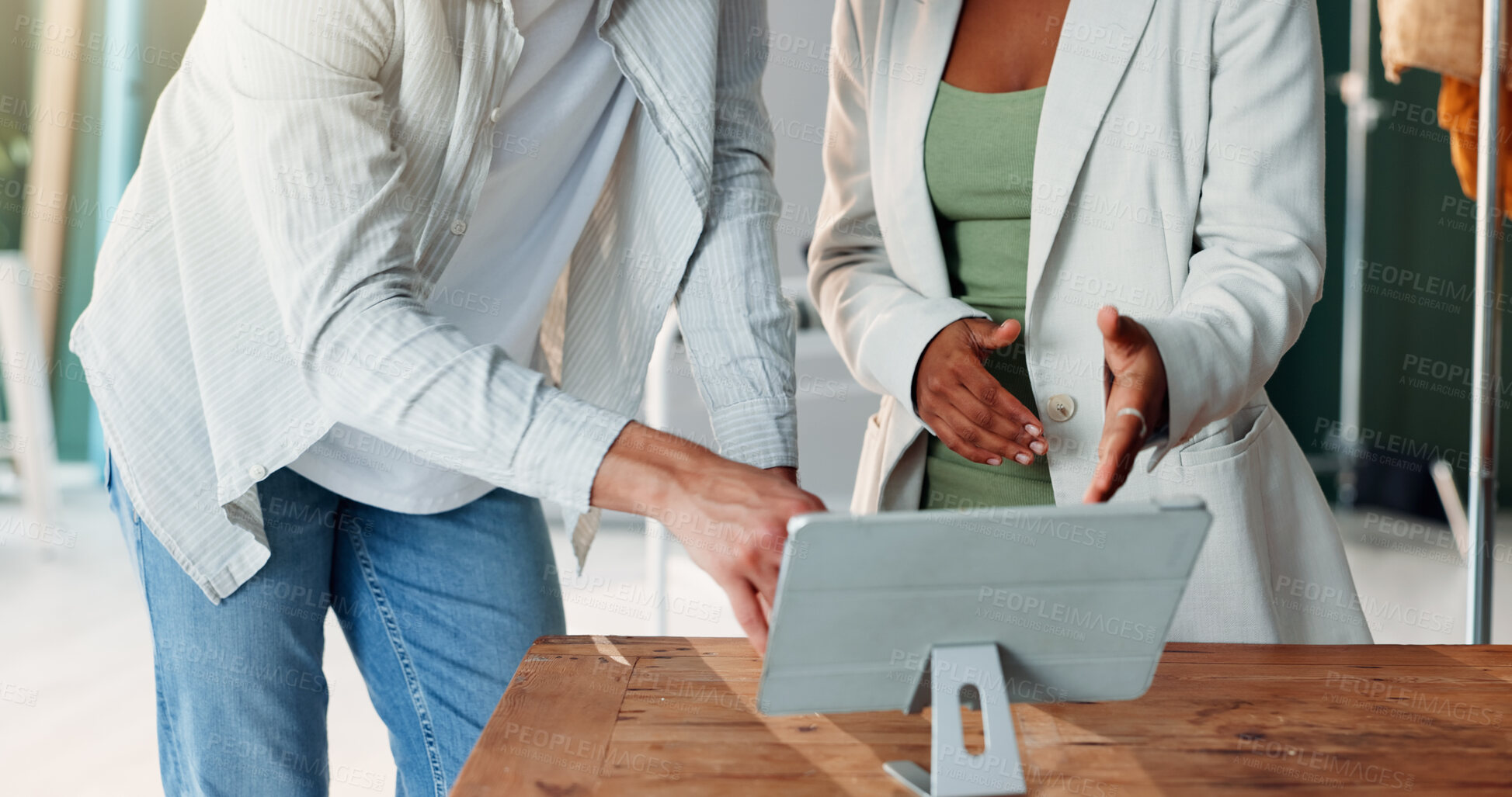 Buy stock photo Hands, photography and tablet with people in studio together for feedback or production planning. App, discussion or photoshoot ideas with photographer team on set for creative film or media review