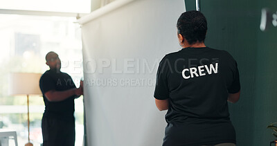 Buy stock photo Backdrop, crew and set up with people in film studio for creative coordination or photoshoot production. Mockup, photography and rolling with team behind the scenes to arrange, install or prepare