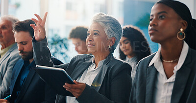 Buy stock photo Business, woman and raised hand with tablet in seminar for question, answer speaker and attention. Mature person, digital and gesture of faq, tradeshow feedback and participation for employee opinion