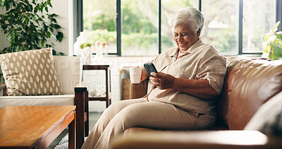 Buy stock photo Coffee, funny and phone with old woman on sofa in home for retirement or social media. App, drinking and laughing with happy senior person in living room of apartment for browsing or communication