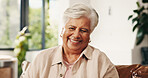 Happy, senior woman and relax at house with peace, calm morning and comfortable on sofa. Portrait, elderly person and laugh on couch, positive attitude and weekend break for retirement in living room