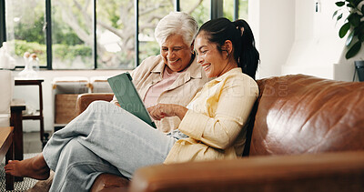 Buy stock photo Tablet, senior mother or daughter on sofa, digital photo album or view nostalgic image for bonding. Laugh, check social media or happy women with tech to watch family movie, browsing together or home