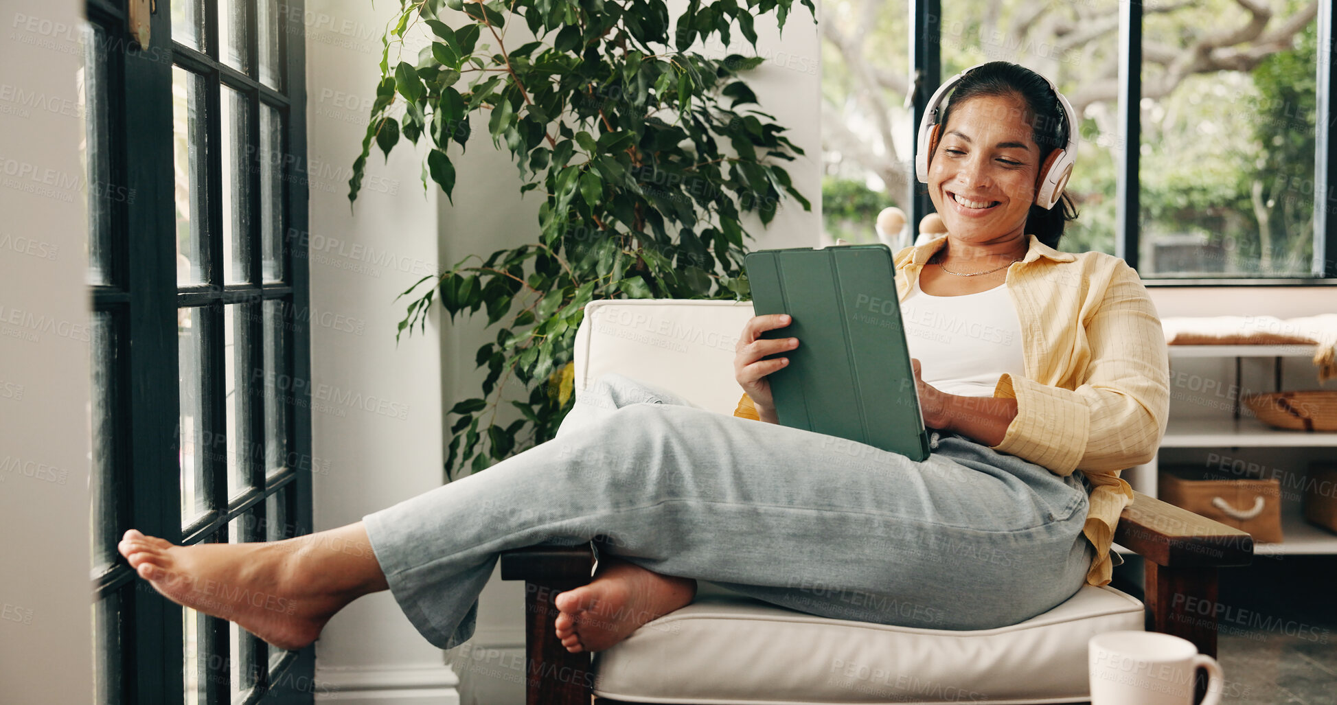 Buy stock photo Headphones, smile and woman with tablet in home, streaming movie website and comfort series to relax. Tech, rest and mature person with subscription service to watch film, podcast video and audiobook