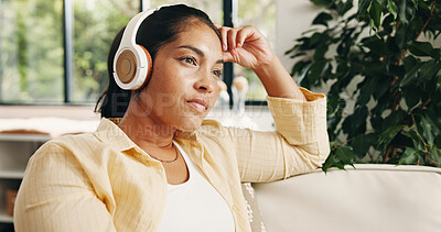 Buy stock photo Woman, relax and thinking in living room with headphones, podcast and listening to music for nostalgia. Mature person, reflection and remember memory in home with audio tech, online radio and song.