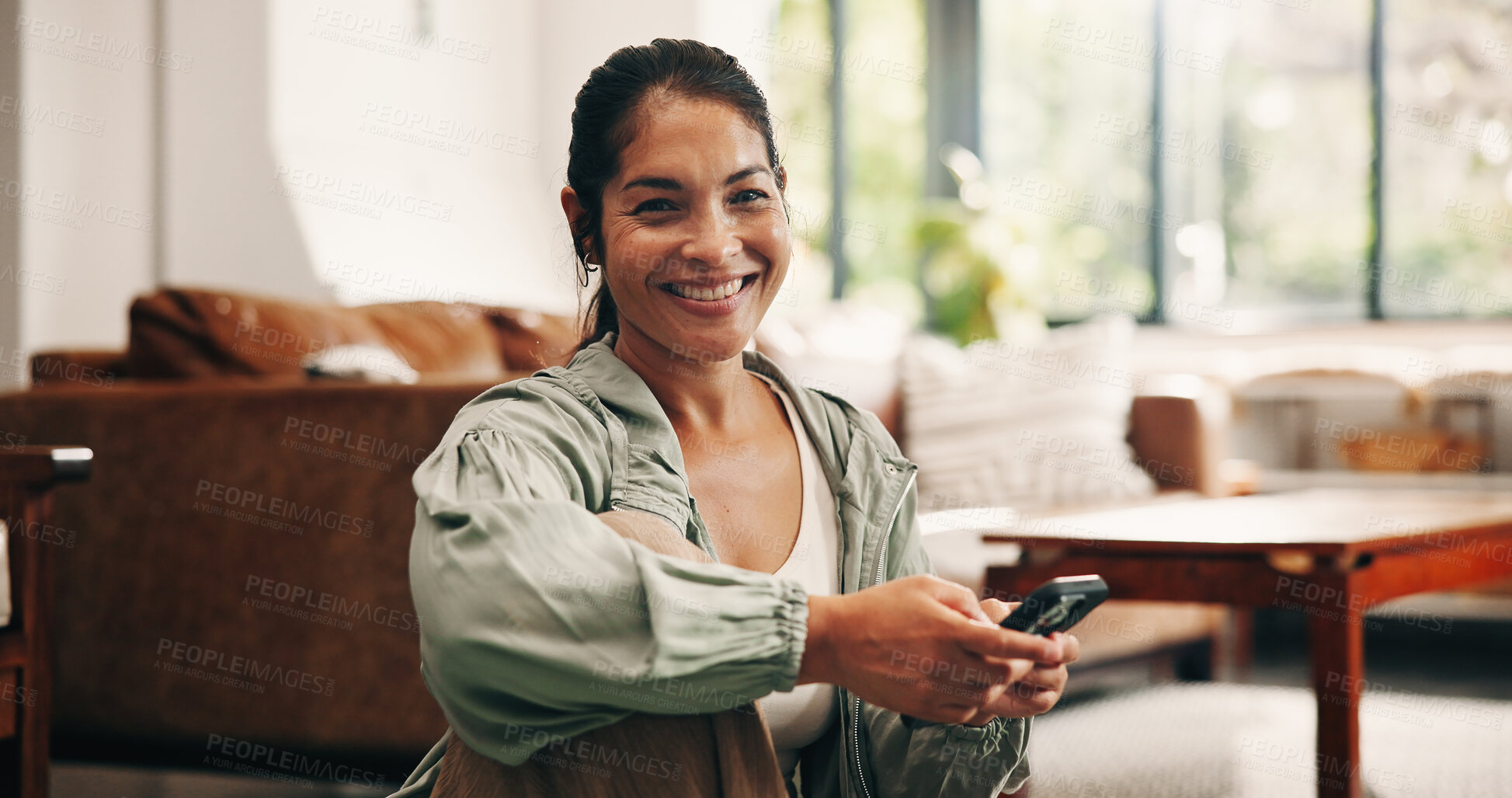 Buy stock photo Portrait, fitness and happy woman with phone in home, workout plan search and download training app. Progress log, smile and mature person with tech in lounge, virtual class sign up or exercise video