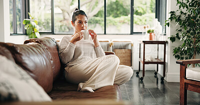 Buy stock photo Calm, woman and thinking with coffee, lounge and planning for decision with caffeine and thoughtful. Morning, reflection and person with hot beverage on couch, remember and wonder with tea in home