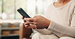 Woman, hands and texting with phone in home for social media, communication or network. Closeup, female person or user browsing on mobile smartphone app or research for online chat or typing in house
